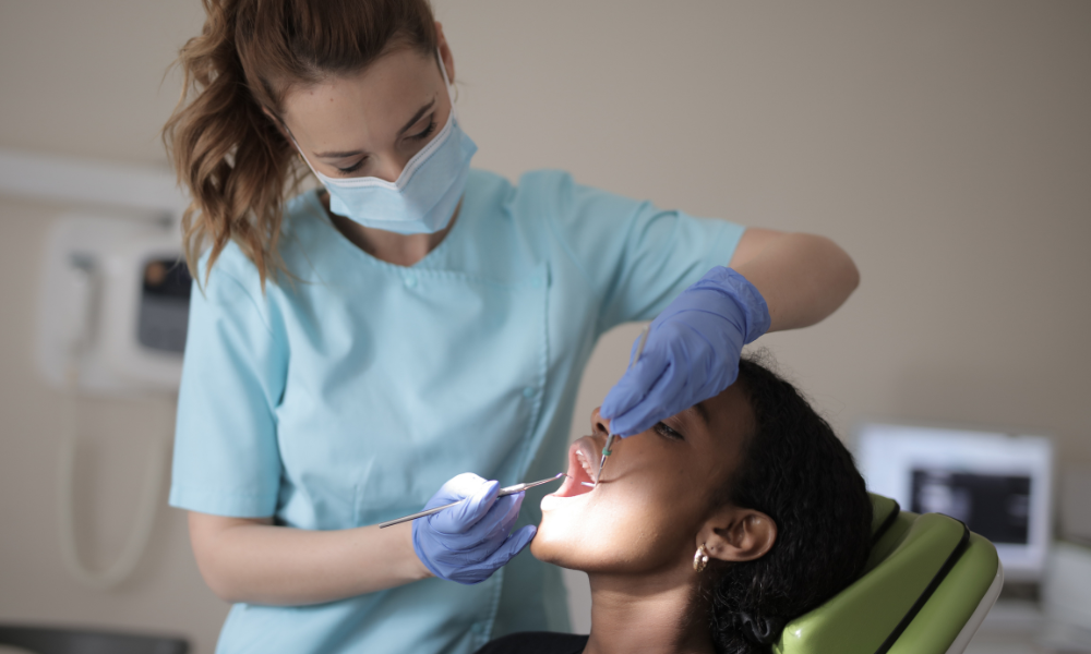 Dentist at Friedman Dental Group examining a patient with utmost care