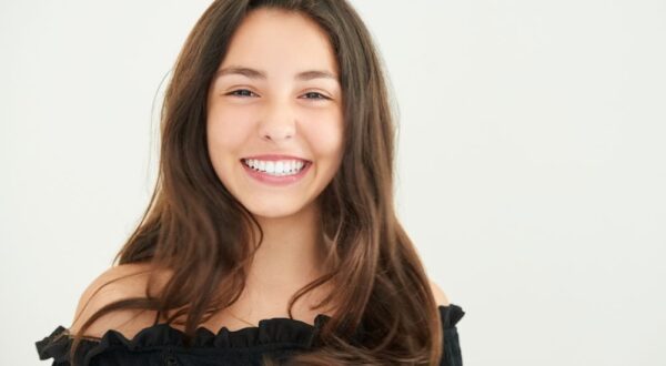 A satisfied patient at Friedman Dental Group, showcasing a radiant, bright smile achieved with expert teeth whitening in Miami.