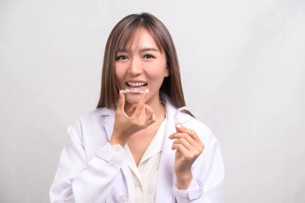 woman about to wear her Invisalign Coral Springs