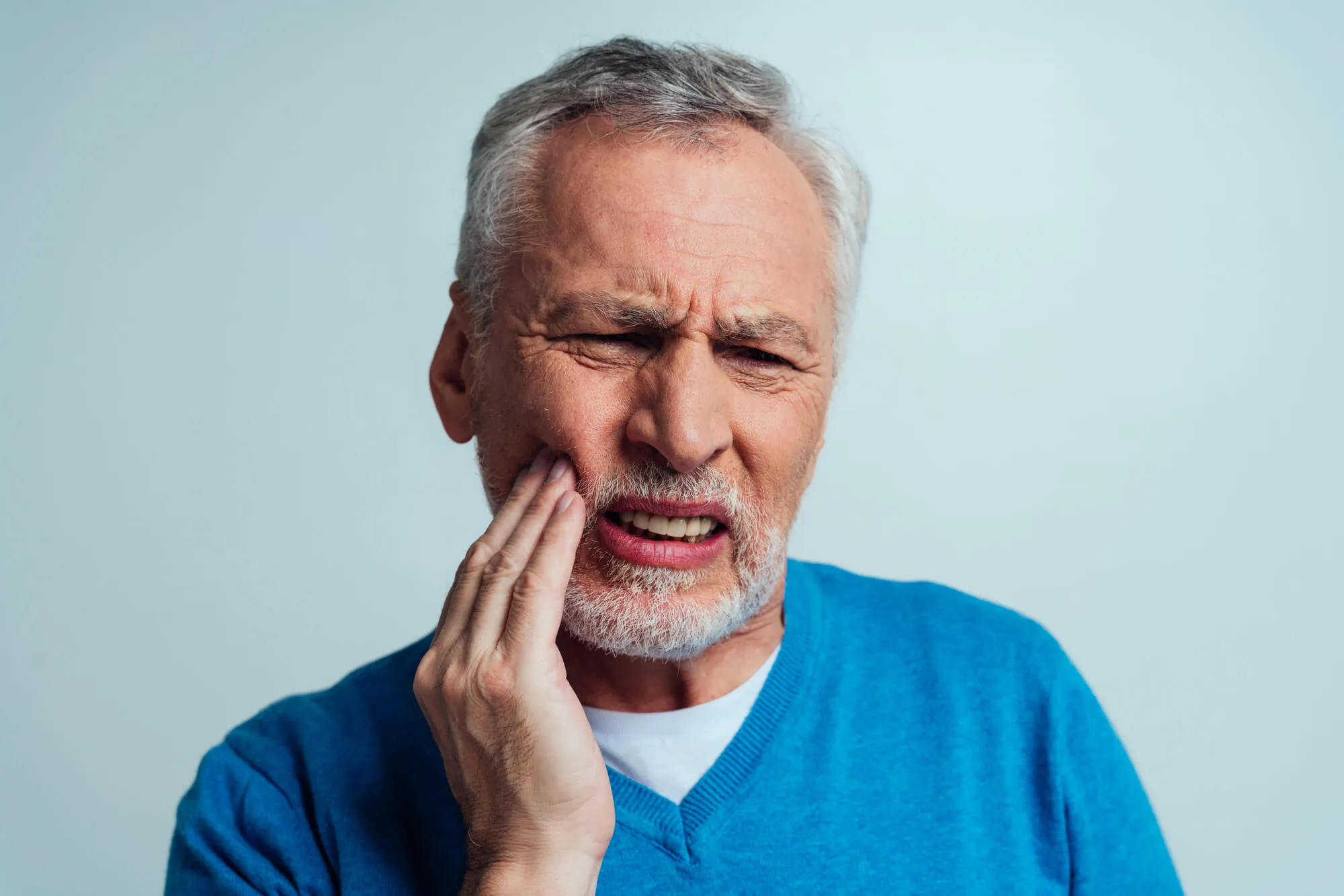 old man in pain needs to see a dentist tamarac cigna