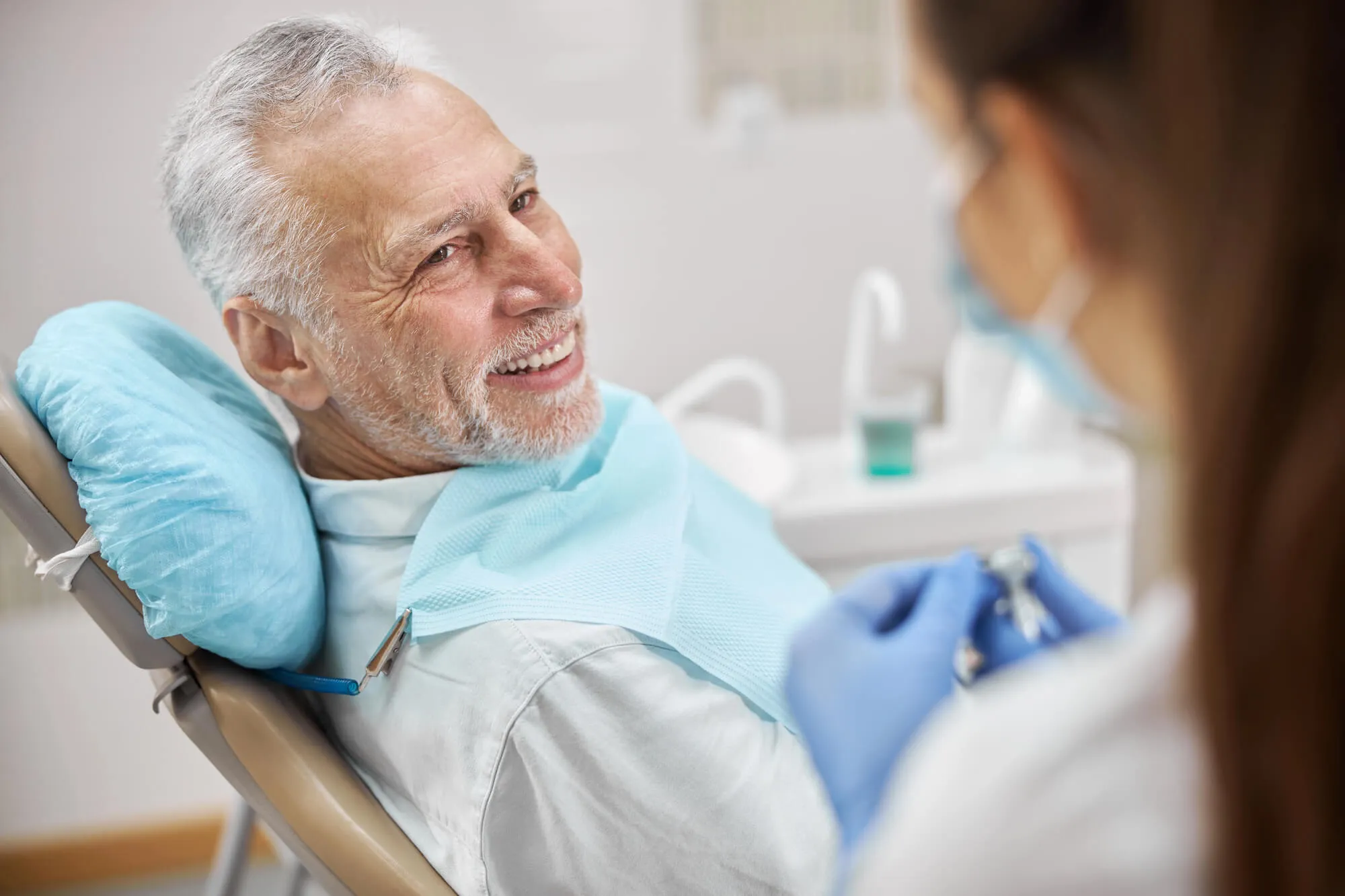patient smiling at dentist coral springs accepting insurance