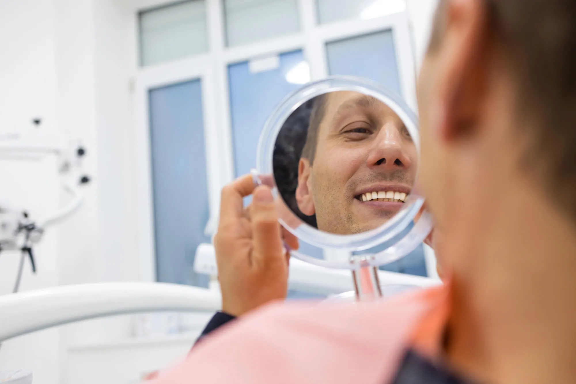 smiling after visiting the dentist tamarac humana gold plus