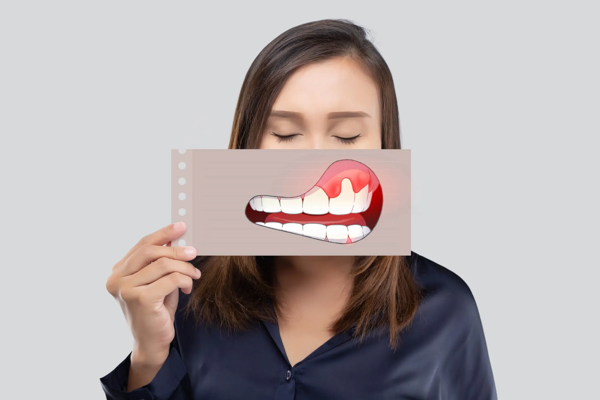 woman-showing-a-printed-gum-disease-paper-to-her-dentist-miami