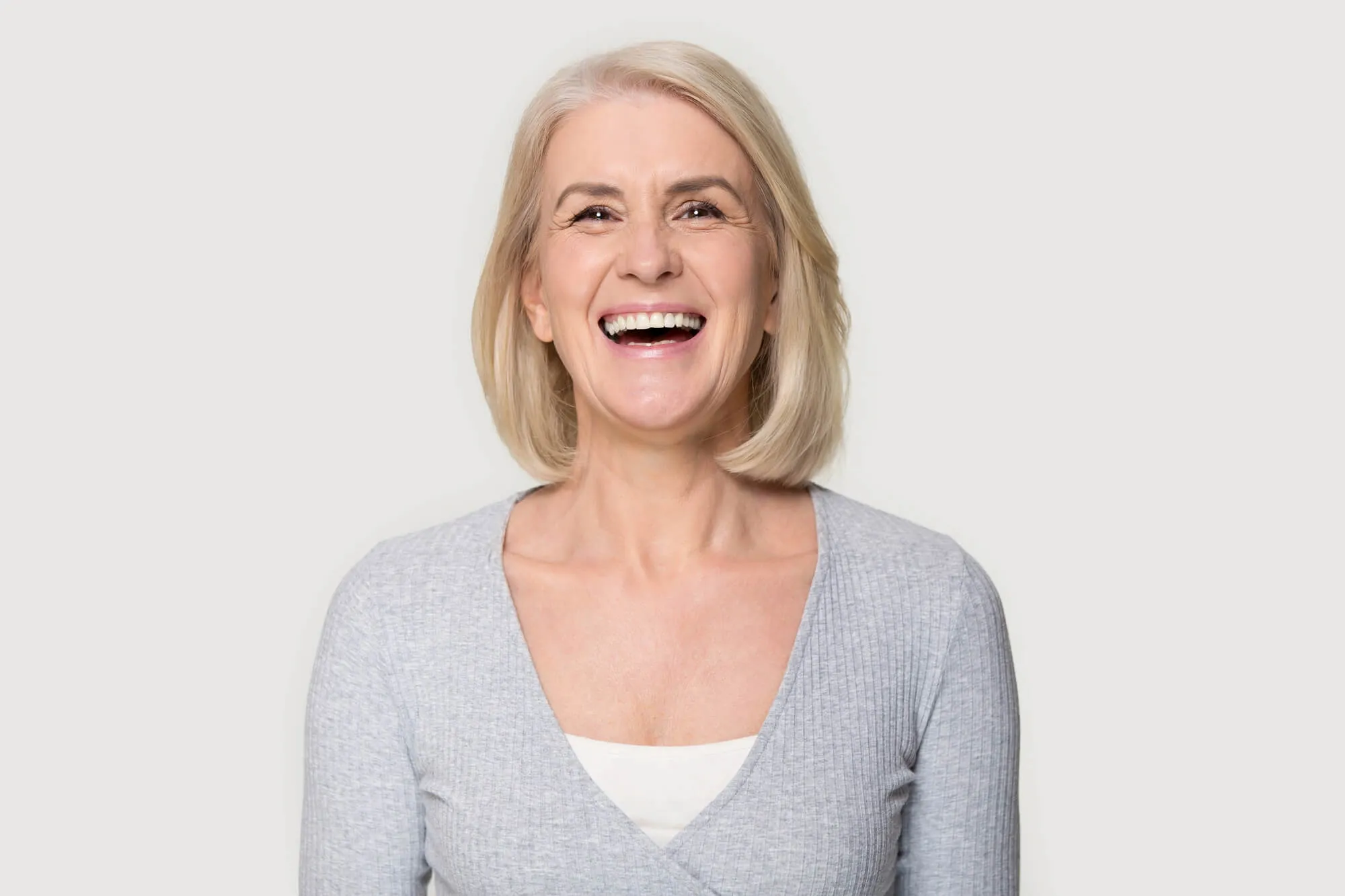 beautiful senior wearing dental implants tamarac humana