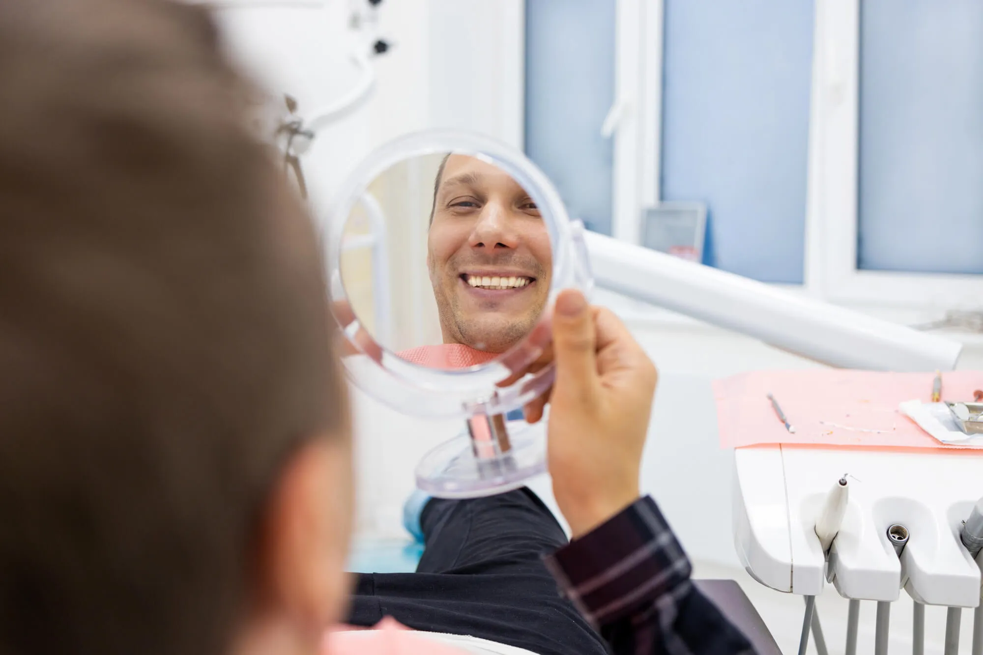 patient checking out Dental Implants Miami