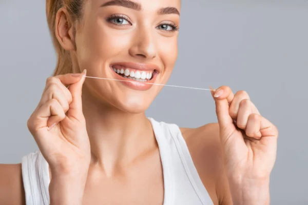 flossing as directed by dentist coral springs